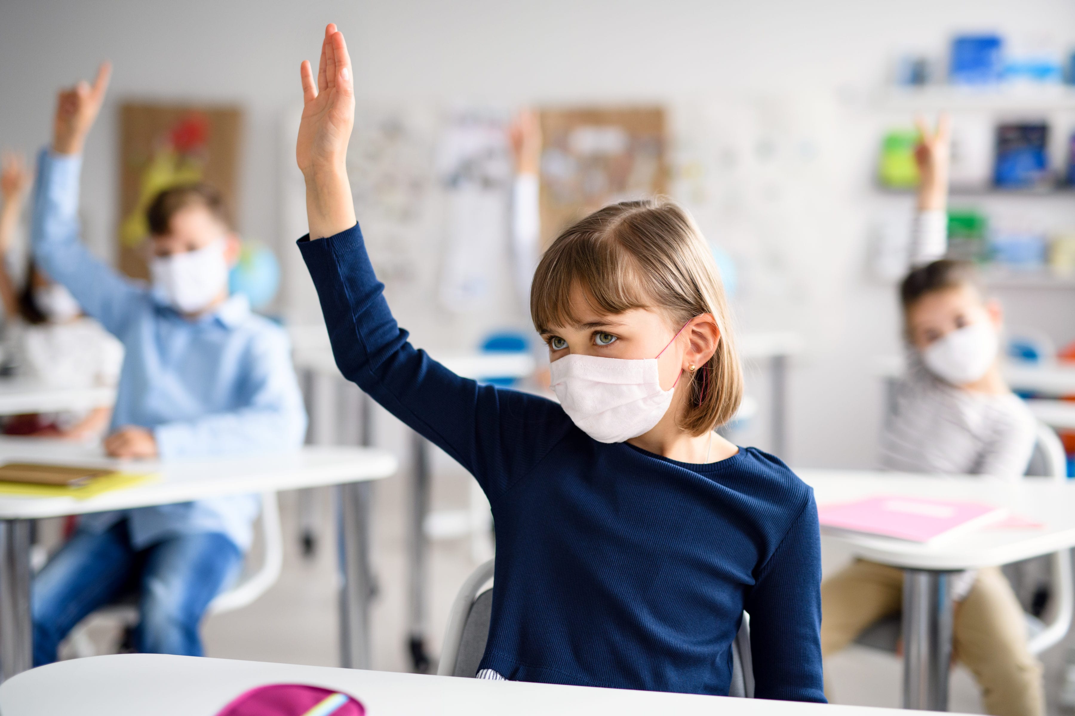 child-with-face-mask-back-at-school-after-covid-19-JNMLF65